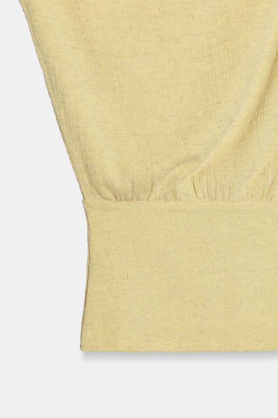 Top asymétrique texturé