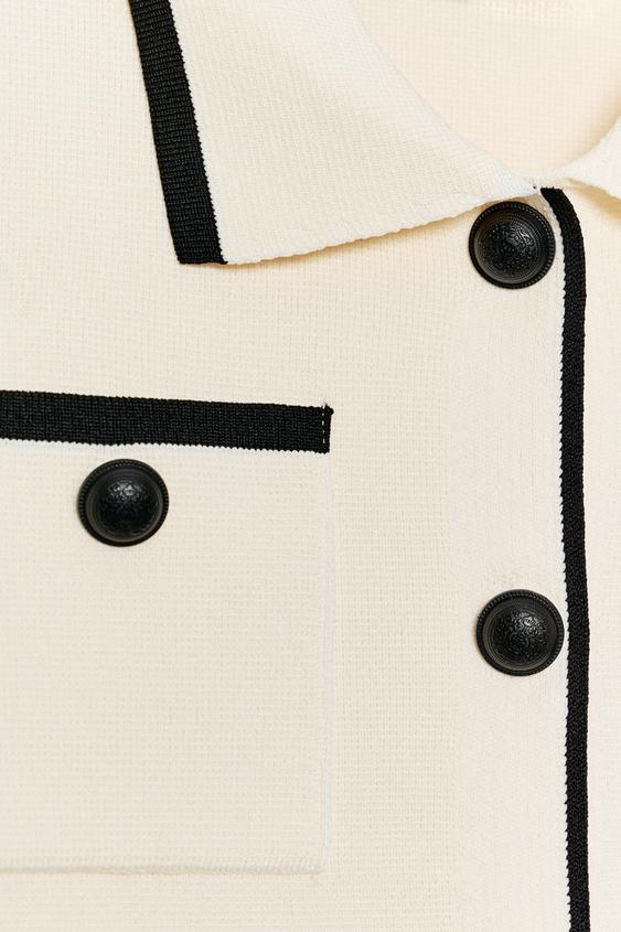 Veste en maille à manches courtes à passepoils contrastés