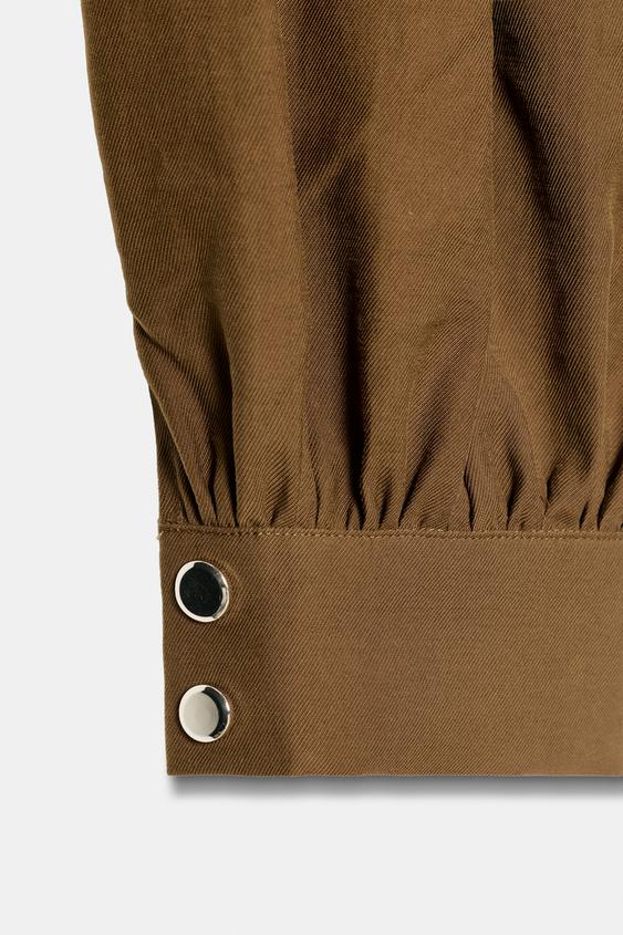 Pantalon bouffant avec ceinture chaîne