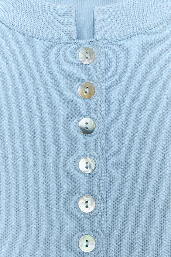 Veste en maille à manches bouffantes