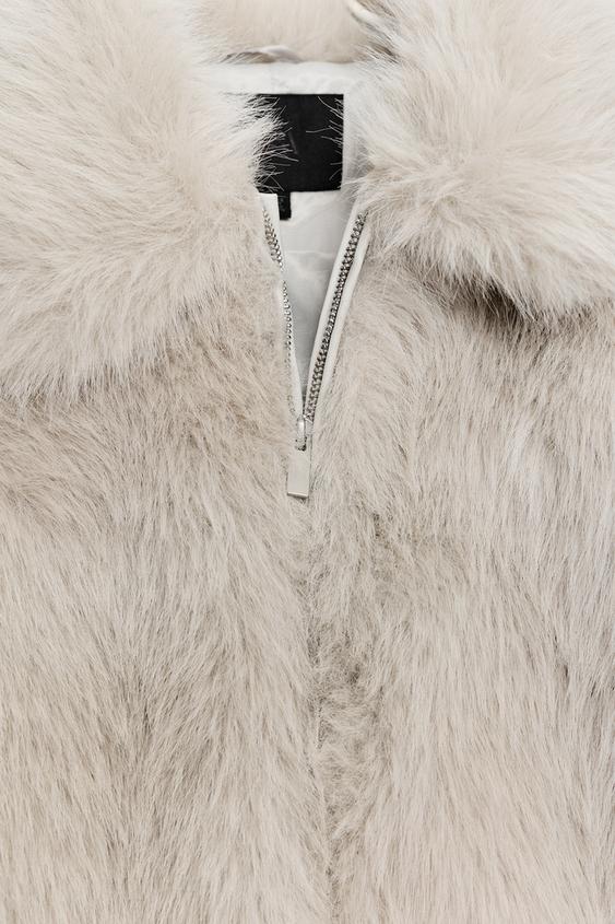 Manteau court effet fourrure à fermeture zippée