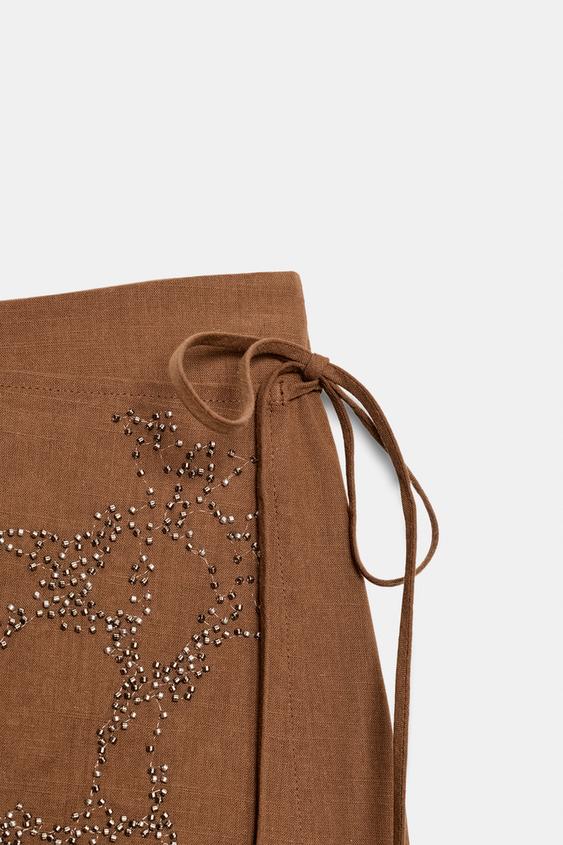 Jupe-culotte à lien noué et perles