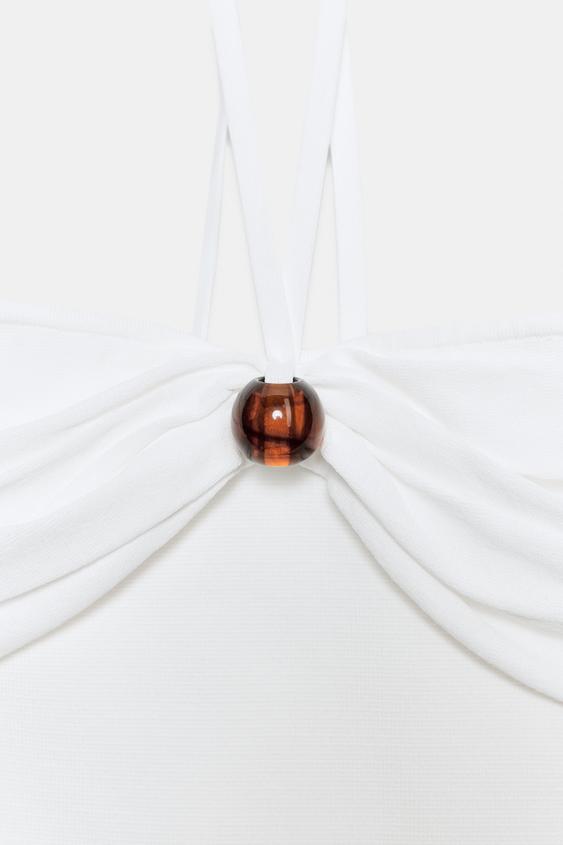 Top bandeau en maille à détail boule