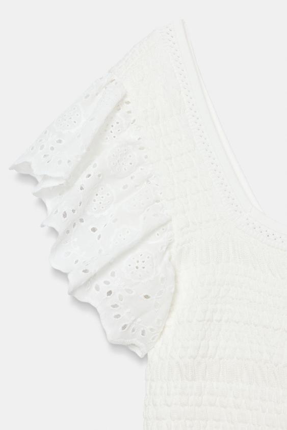 Top en maille à broderies ajourées