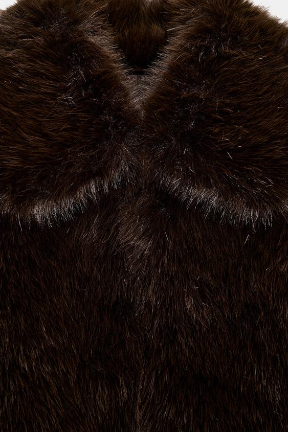 Manteau court effet fourrure à col revers
