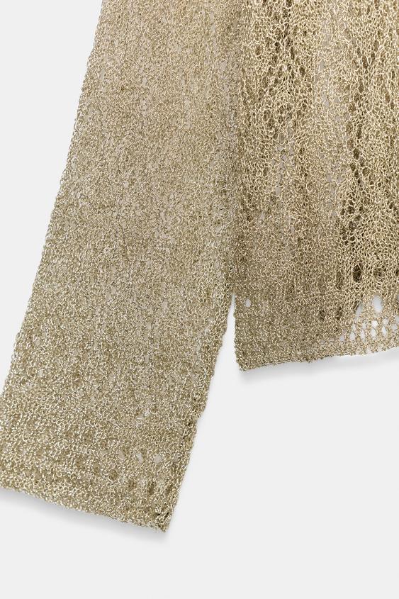 Pull en maille pointelle à fil métallisé