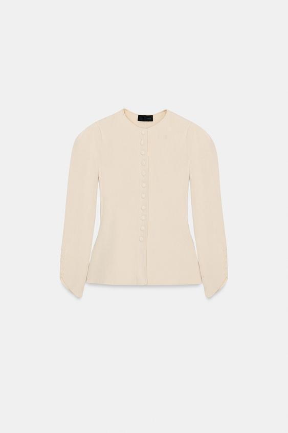 Veste en maille à manches bouffantes