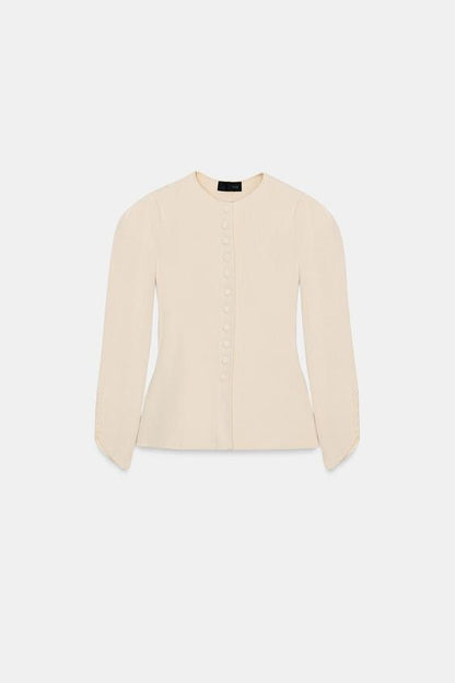 Veste en maille à manches bouffantes