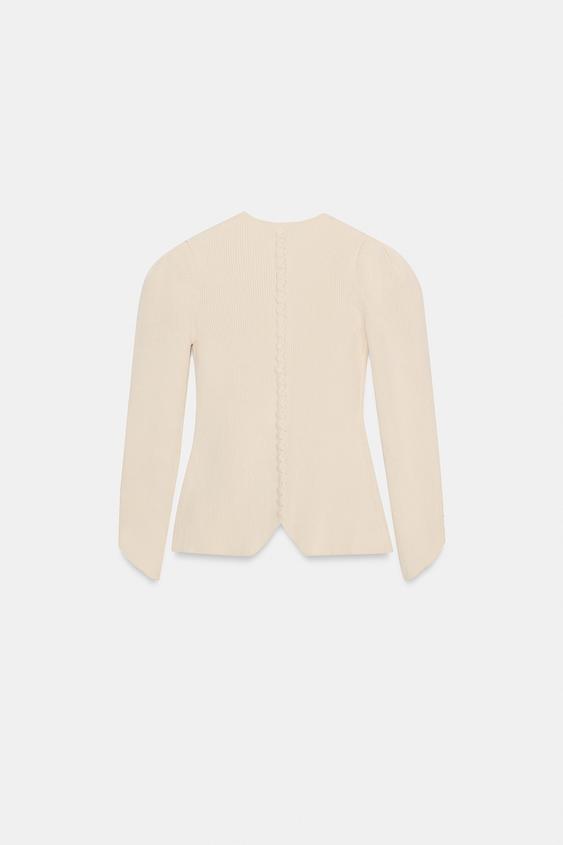 Veste en maille à manches bouffantes