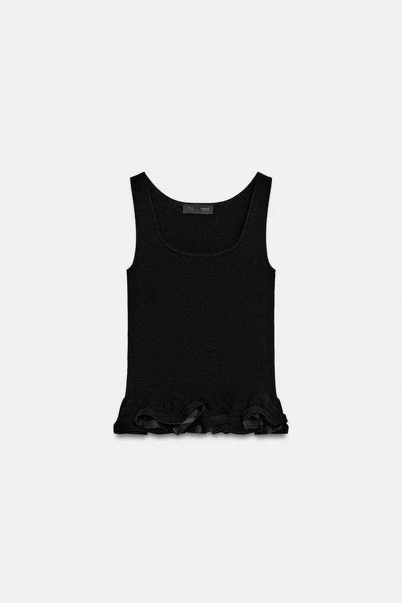 Top en maille à bas ondulé