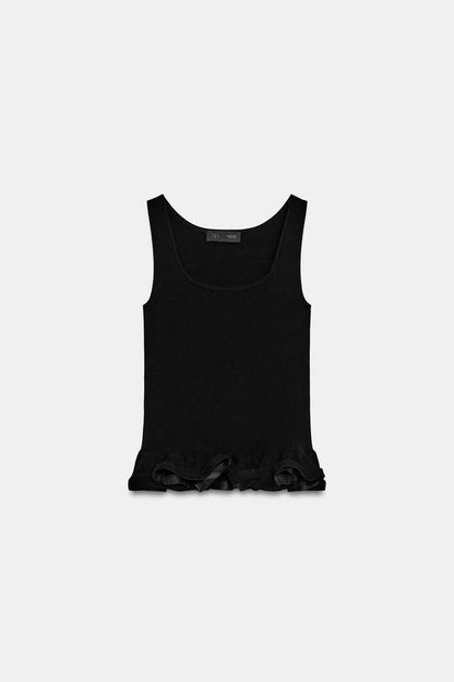 Top en maille à bas ondulé
