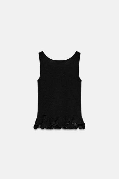 Top en maille à bas ondulé