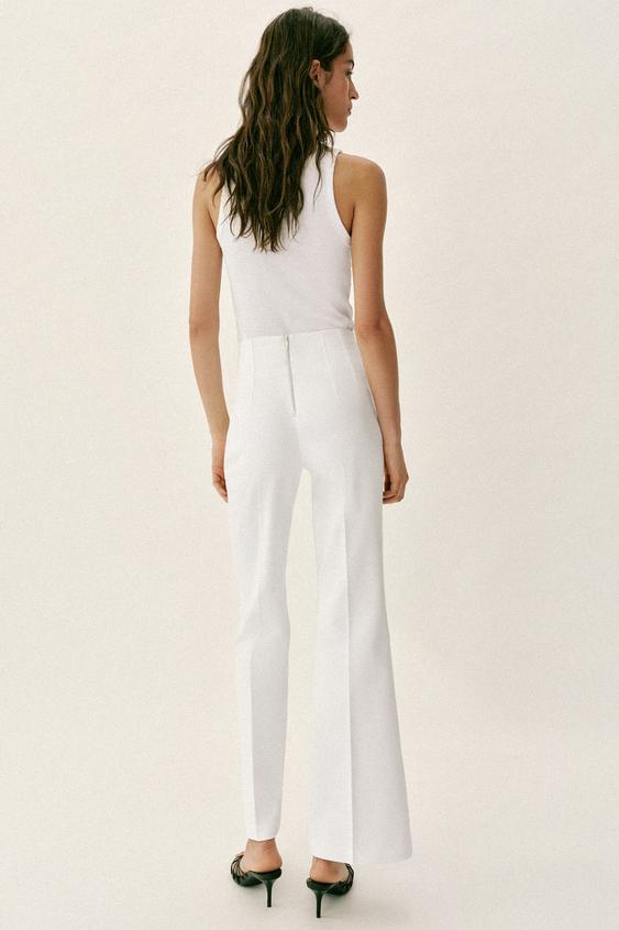Pantalon taille haute à fermeture zippée au dos