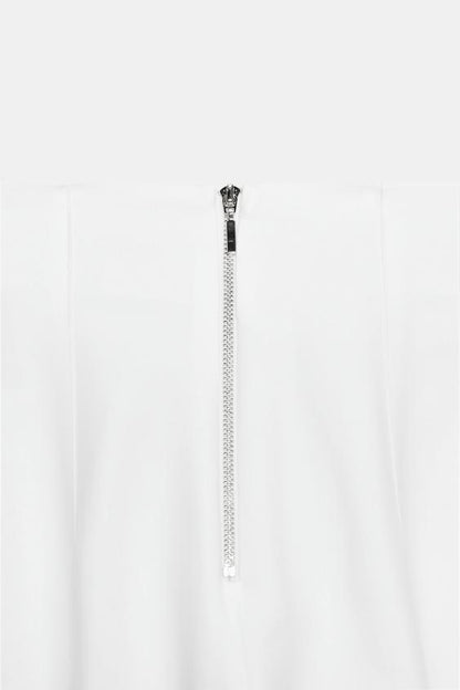 Pantalon taille haute à fermeture zippée au dos