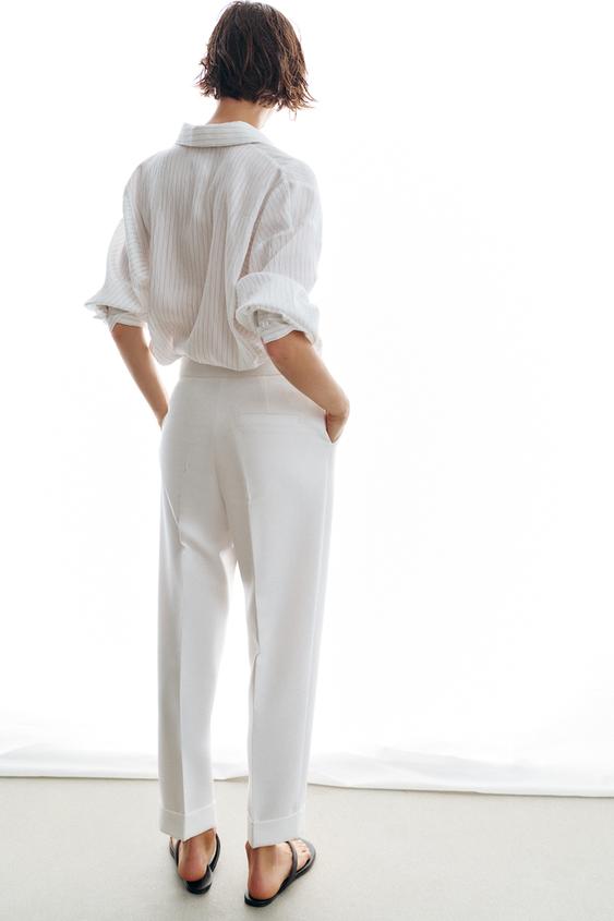 Pantalon à plis avec revers au bas