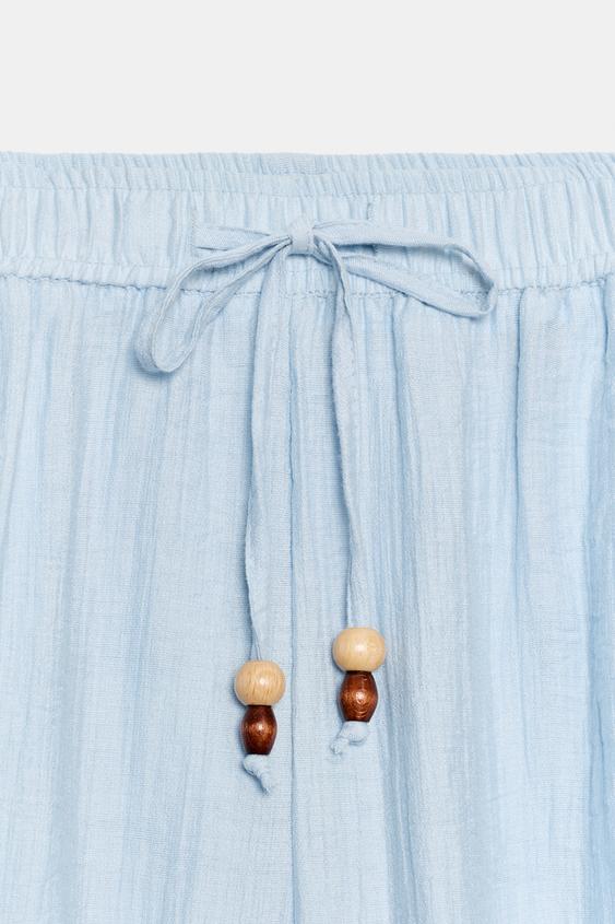 Pantalon coupe barrel texturé