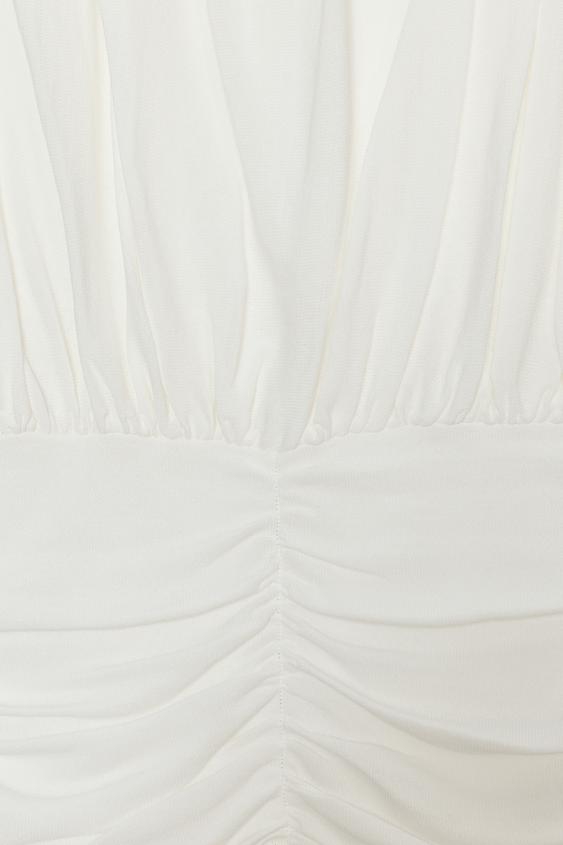 Top drapé en maille