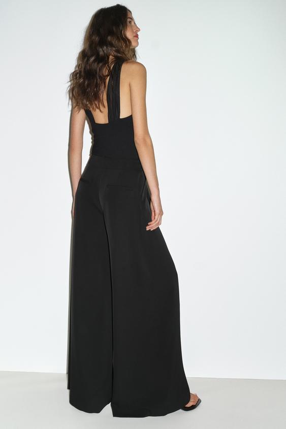 Pantalon palazzo à bouton doré