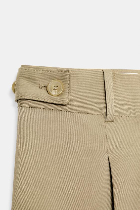 Pantalon taille basse à passants latéraux