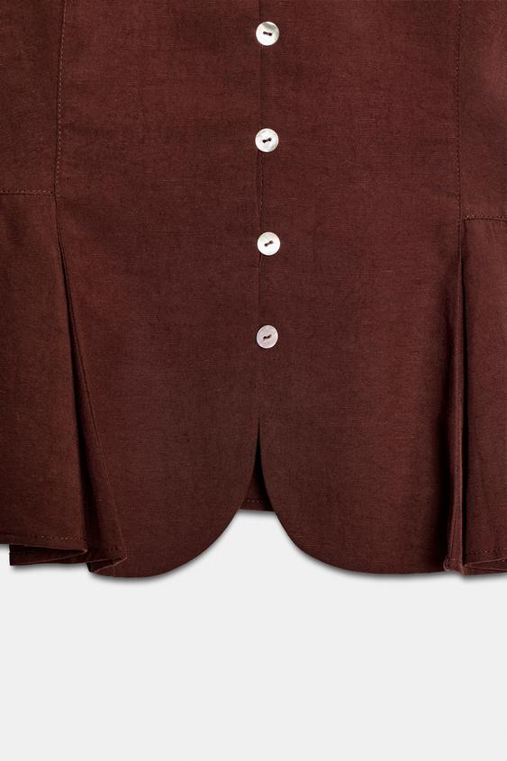 Top peplum à pinces