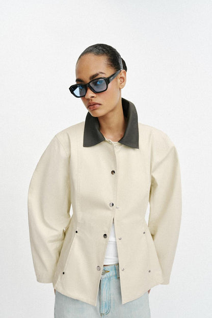 Blouson peplum à col contrasté