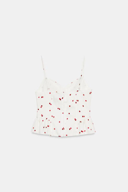 Top satiné à volants et motif fraises