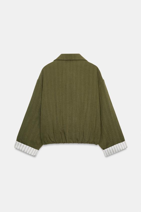 Veste courte à manches retroussées