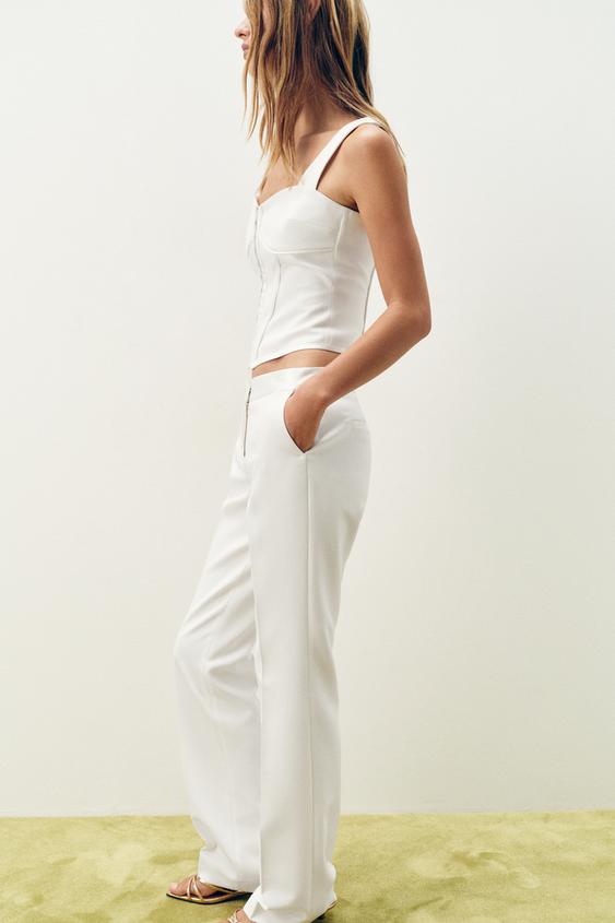 Top bustier à passepoils satinés