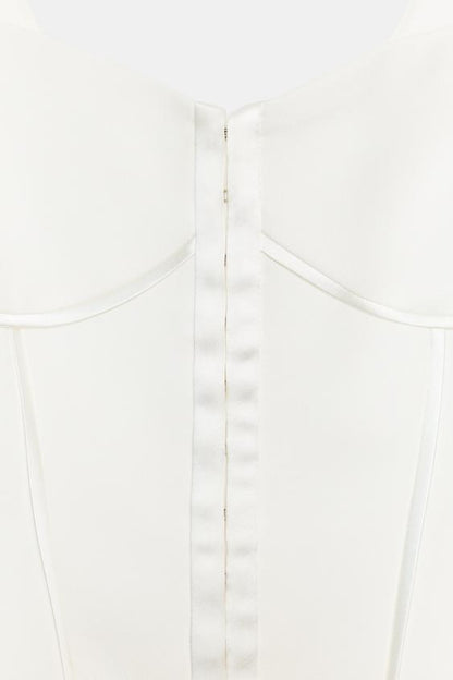 Top bustier à passepoils satinés