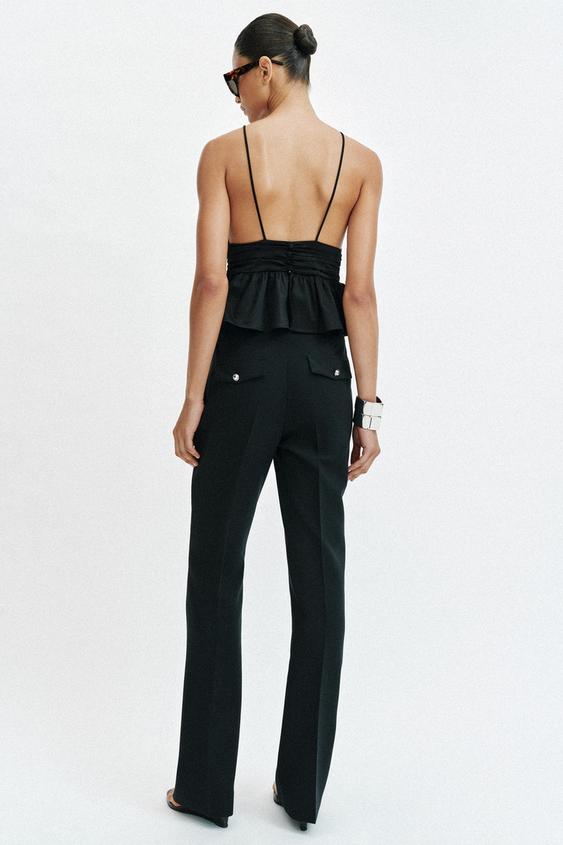 Pantalon coupe évasée à boutons