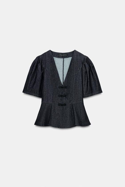Top peplum à brandebourgs