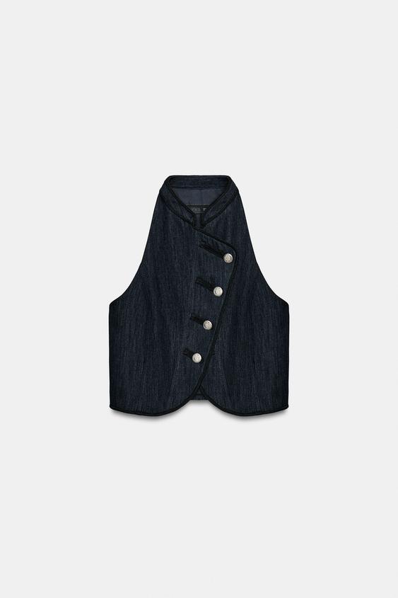 Gilet dos-nu à passepoils contrastés