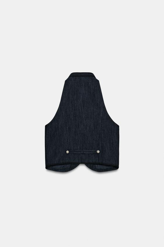 Gilet dos-nu à passepoils contrastés