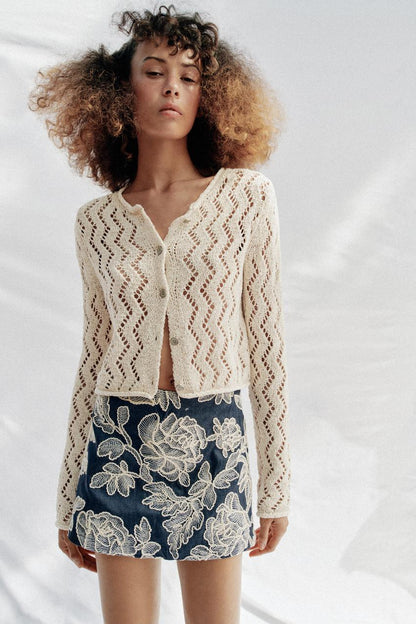 Veste en maille ajourée zigzag
