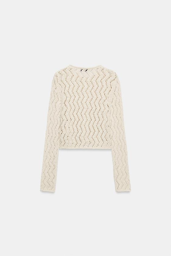 Veste en maille ajourée zigzag