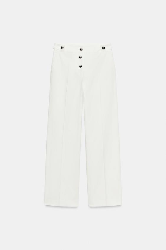 Pantalon à boutons métalliques