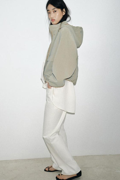 Blouson enduite à capuche