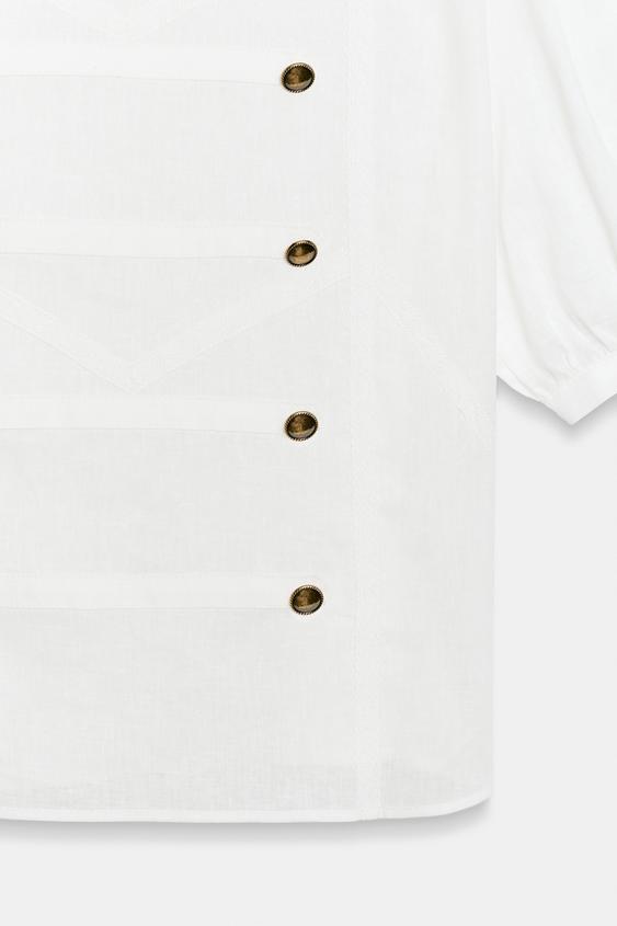 Chemise à brandebourgs à manches courtes bouffantes