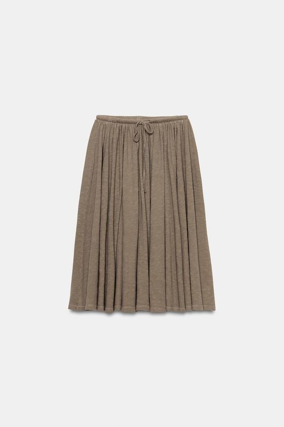 Jupe en tissu flammé à godets