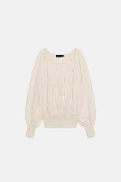 Blouse en maille à col bateau