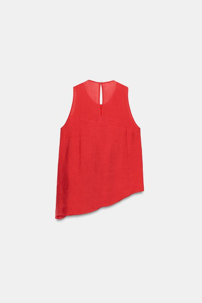 Top asymétrique à volants