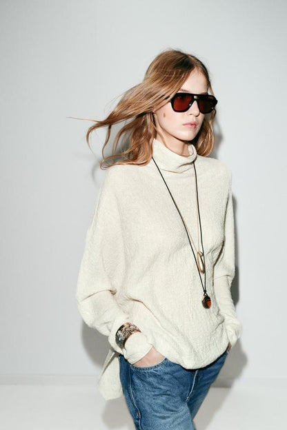 Pull effet cape en maille