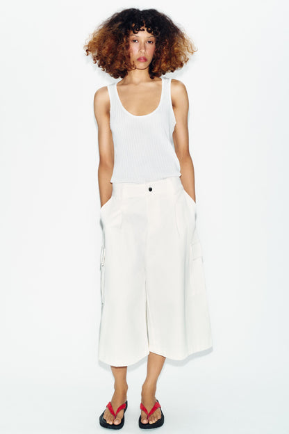 Top semi-transparent en maille contrastée
