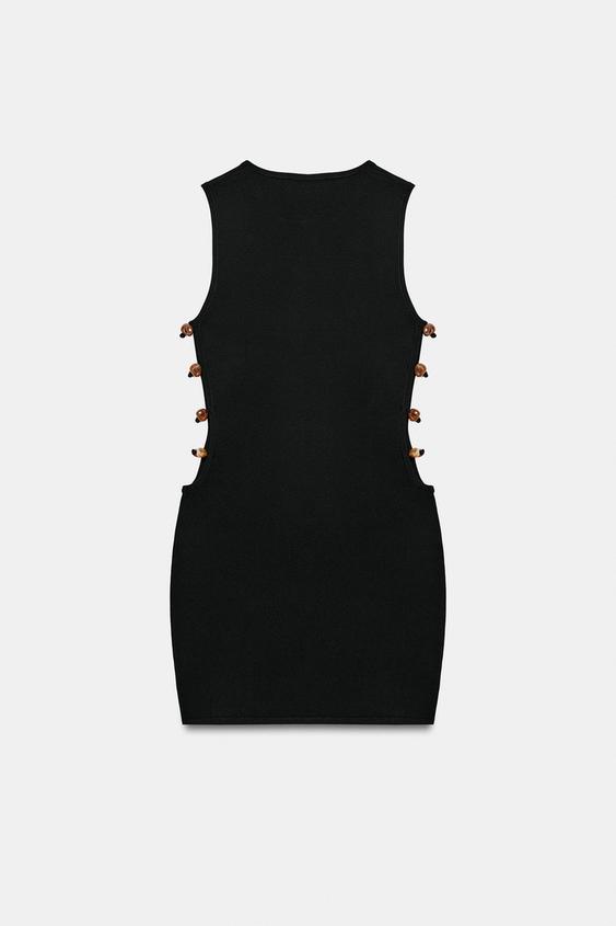 Robe courte en maille à fentes et perles