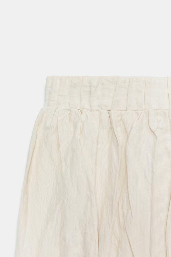 Jupe midi en maille effet froissé
