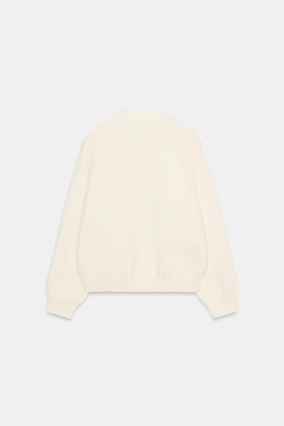 Veste en maille à bouton contrasté
