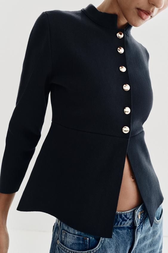 Veste en maille peplum à bouton doré