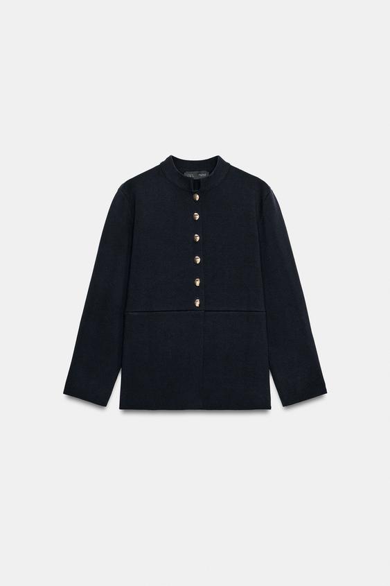 Veste en maille peplum à bouton doré