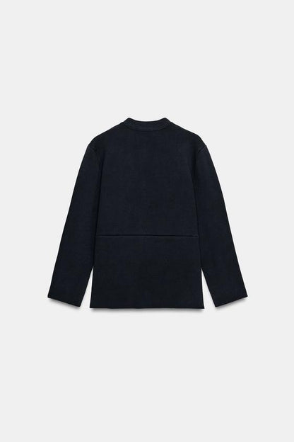 Veste en maille peplum à bouton doré