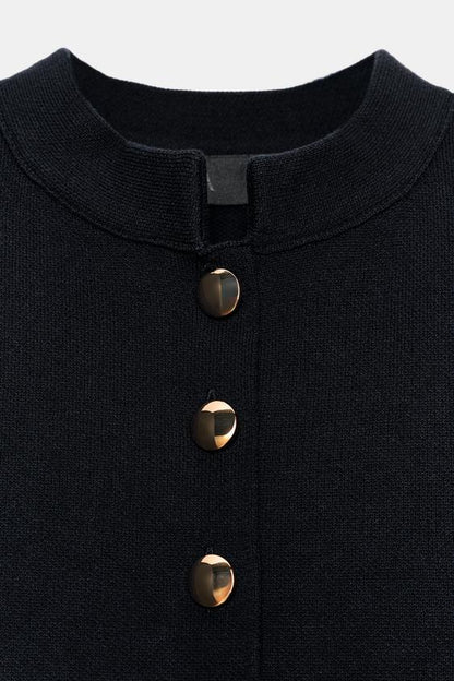 Veste en maille peplum à bouton doré